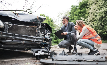 People examine car after a wreck